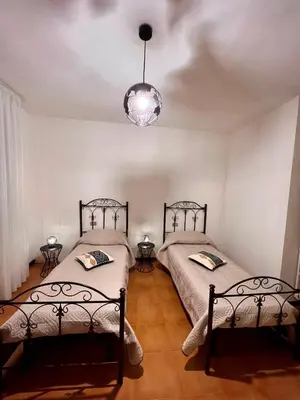 Letto o letti in una camera di Villa Mariaurelia