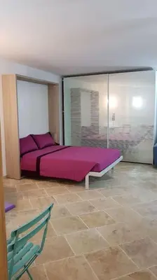 Letto o letti in una camera di Villa Alberto