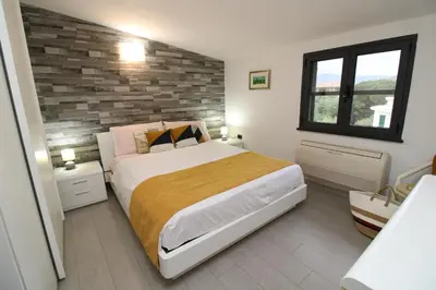 Letto o letti in una camera di Corona's Apartment- Fronte Spiaggia