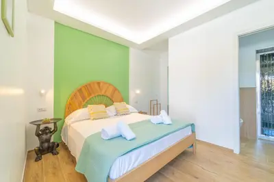 Letto o letti in una camera di Mensos Rooms