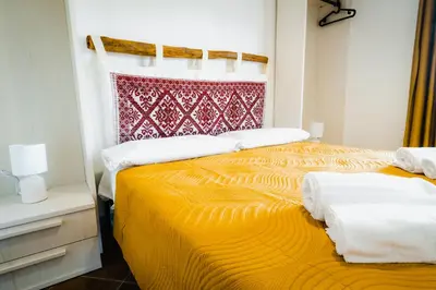 Letto o letti in una camera di Panoramic Loft con uso cucina ,Casa Raimonda, Ammentos Posada