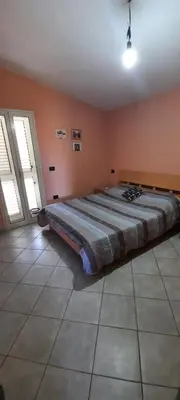 Letto o letti in una camera di Casa Orosei Mannu