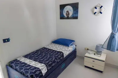 Letto o letti in una camera di Casa Ilaria Calaliberotto