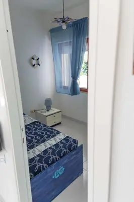 Letto o letti in una camera di Casa Ilaria Calaliberotto