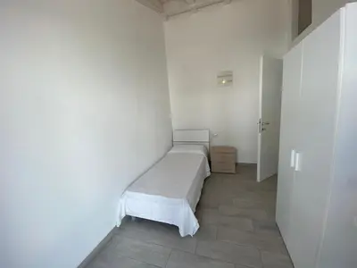 Letto o letti in una camera di Villetta 6 La Caletta
