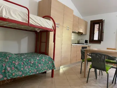 Cucina o angolo cottura di FAN SARD Villetta 10 posti letto FBU-ZAN02
